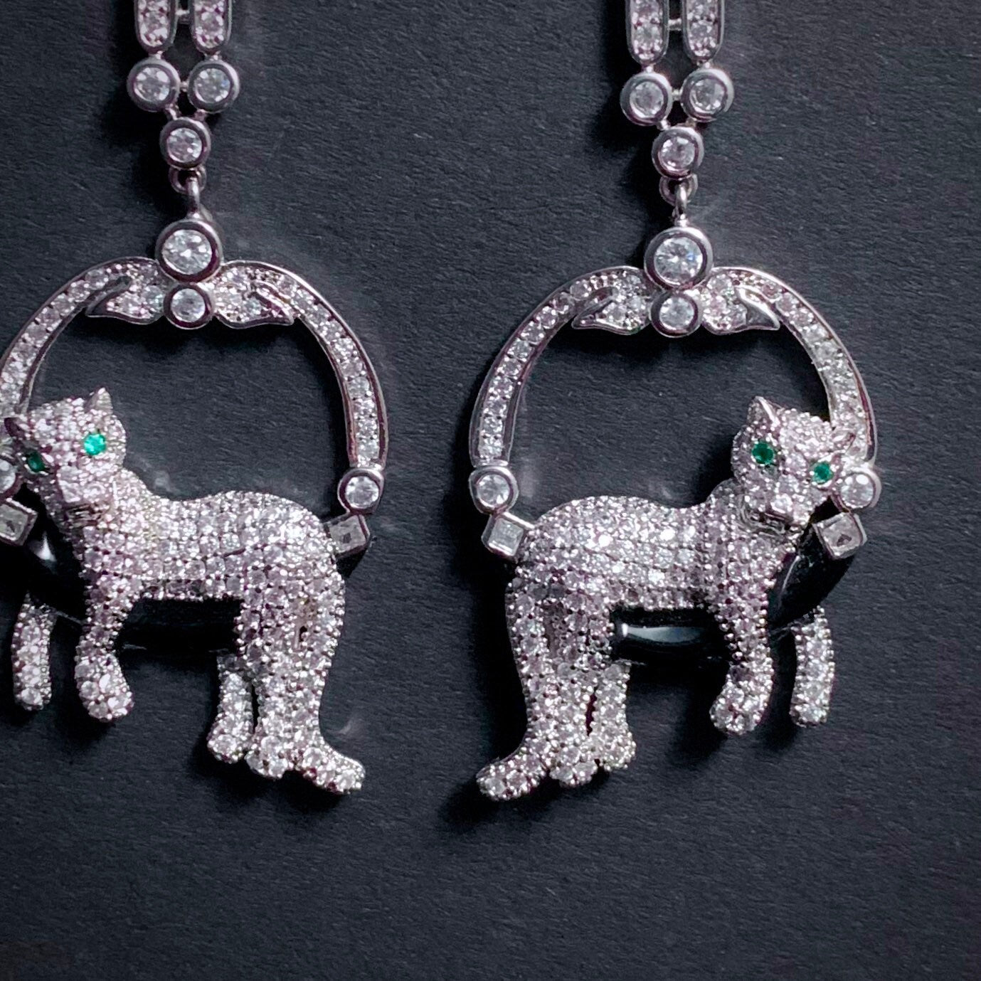 Lounging Leopard Earrings in Silver with Emerald Eyes